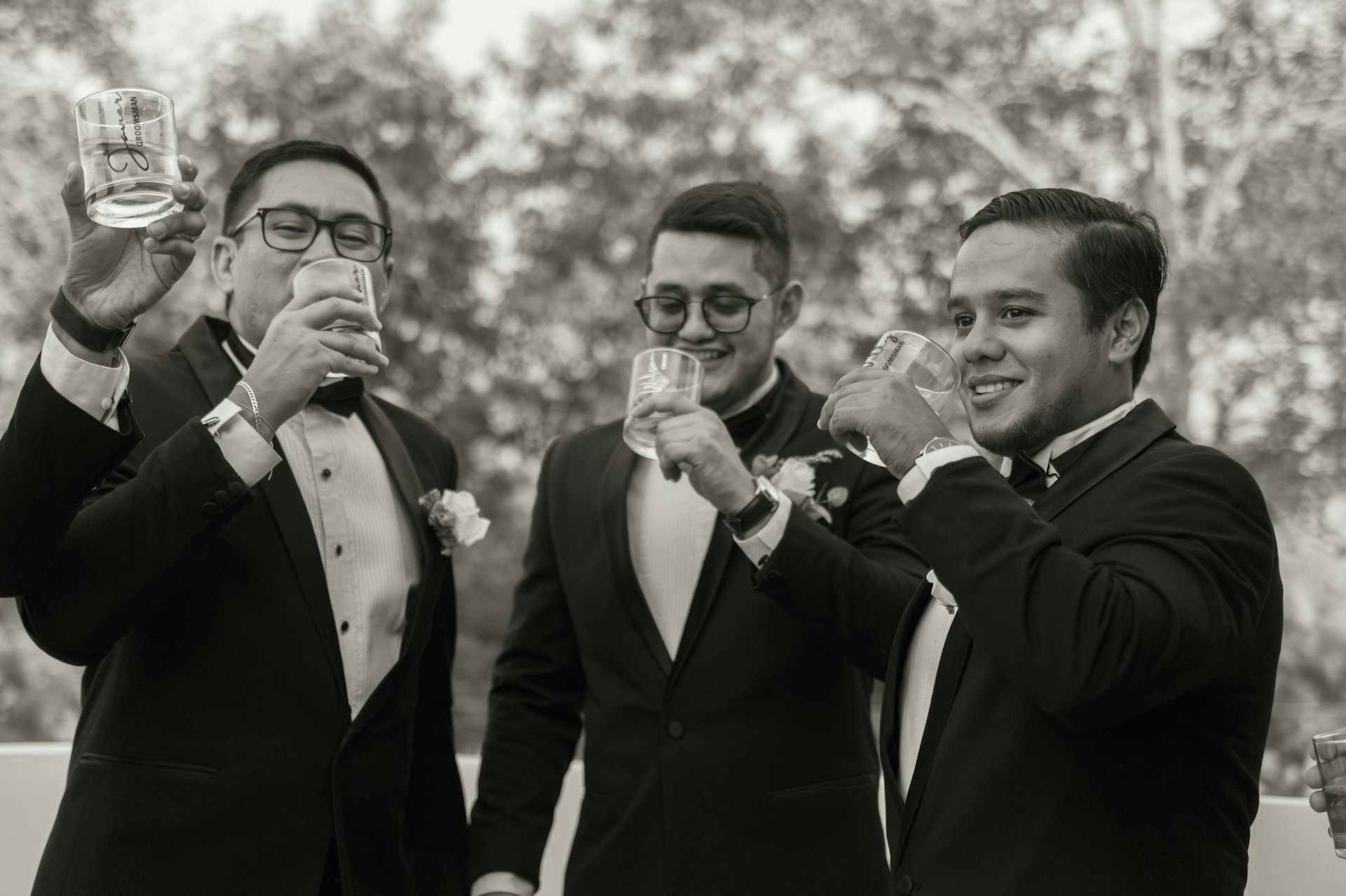 Men celebrating in tuxedos